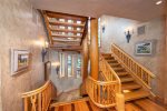 Custom woodwork embellishes the stairwells that run on both ends of the home for easy access to all four floors.